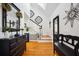 Foyer boasts hardwood floors, a staircase with black and white accents, and a decorative mirror at 516 & 508 Robnshers Pl, Ridgeville, SC 29472