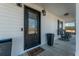 Charming covered front porch with rocking chairs and a decorative front door at 516 & 508 Robnshers Pl, Ridgeville, SC 29472