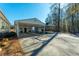 Detached two-car garage featuring matching paint, a covered area, and ample parking space near treeline at 516 & 508 Robnshers Pl, Ridgeville, SC 29472