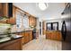Well-lit kitchen boasts sleek countertops, wood cabinets, and modern appliances for an inviting cooking space at 516 & 508 Robnshers Pl, Ridgeville, SC 29472