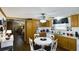 Cozy kitchen with white countertops, wooden cabinetry, dining table, and a bright, functional layout at 516 & 508 Robnshers Pl, Ridgeville, SC 29472
