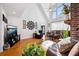Spacious living room boasts hardwood floors, vaulted ceiling, and large windows for plenty of natural light at 516 & 508 Robnshers Pl, Ridgeville, SC 29472