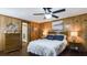 Tranquil main bedroom featuring warm wood walls, plush bedding, and soft lighting, for a restful retreat at 516 & 508 Robnshers Pl, Ridgeville, SC 29472