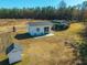 Outbuildings, including a workshop with tractor, and storage, on a spacious lot, offering versatile functionality at 516 & 508 Robnshers Pl, Ridgeville, SC 29472