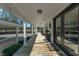 Covered wraparound porch with a wood floor, plants, seating, and views of the surrounding landscape at 516 & 508 Robnshers Pl, Ridgeville, SC 29472