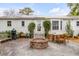 Outdoor patio with a fire pit, dining table, and a view of the backyard at 521 London Bridge Rd, Mount Pleasant, SC 29464