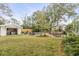 Expansive backyard with a pool, pool house, and comfortable lounge seating for outdoor relaxation at 521 London Bridge Rd, Mount Pleasant, SC 29464