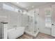 Modern bathroom with a soaking tub, glass shower, and natural light at 521 London Bridge Rd, Mount Pleasant, SC 29464