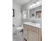 Well-lit bathroom featuring a marble vanity, neutral colors, and a grid tile floor at 521 London Bridge Rd, Mount Pleasant, SC 29464