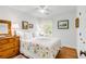Cozy bedroom with hardwood floors, a patterned quilt, and ample natural light at 521 London Bridge Rd, Mount Pleasant, SC 29464