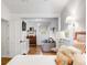 Bright bedroom showing seating area, hardwood floors, and open doorway at 521 London Bridge Rd, Mount Pleasant, SC 29464