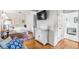 Bedroom with hardwood floors, TV and view into the bathroom at 521 London Bridge Rd, Mount Pleasant, SC 29464
