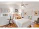 Cozy bedroom with a decorative headboard, soft lighting, and a ceiling fan at 521 London Bridge Rd, Mount Pleasant, SC 29464