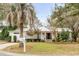 Charming single-story home with well-manicured lawn, mature trees, and inviting front porch at 521 London Bridge Rd, Mount Pleasant, SC 29464