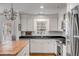 Well-equipped kitchen boasts updated appliances, white cabinetry, and functional design at 521 London Bridge Rd, Mount Pleasant, SC 29464