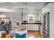 Well-lit kitchen featuring stainless steel appliances, white cabinetry, and butcher block island at 521 London Bridge Rd, Mount Pleasant, SC 29464