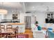 Bright and airy living space seamlessly connects a modern kitchen with stainless appliances and a cozy living room at 521 London Bridge Rd, Mount Pleasant, SC 29464