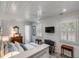 Bright main bedroom with wood floors, a cozy chair, and a view into the ensuite bathroom at 521 London Bridge Rd, Mount Pleasant, SC 29464