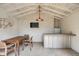Relaxing pool house with a bar, mini-fridge, table, and TV for outdoor entertaining at 521 London Bridge Rd, Mount Pleasant, SC 29464
