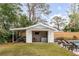 Backyard pool house with lounge seating, bar, and open space at 521 London Bridge Rd, Mount Pleasant, SC 29464