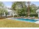 Beautiful pool, patio area, and lush lawn, creating a perfect setting for outdoor entertaining at 521 London Bridge Rd, Mount Pleasant, SC 29464