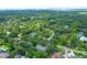 This aerial view features a residential area with green trees, waterways, and a bridge in the distance at 652 E Hobcaw Dr, Mount Pleasant, SC 29464