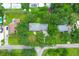 This aerial view showcases a property with a large yard, mature trees and neighboring homes in a residential neighborhood at 652 E Hobcaw Dr, Mount Pleasant, SC 29464
