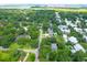 Aerial view of a neighborhood showcasing mature trees, well-maintained homes, and a lush, green landscape at 652 E Hobcaw Dr, Mount Pleasant, SC 29464