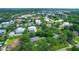 This aerial view shows homes nestled among mature trees in a quaint neighborhood, offering both privacy and community at 652 E Hobcaw Dr, Mount Pleasant, SC 29464