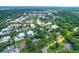 This aerial view captures a cozy neighborhood filled with lush trees, offering a serene and private living environment at 652 E Hobcaw Dr, Mount Pleasant, SC 29464
