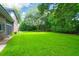 Large, lush backyard with a level lawn, perfect for outdoor activities and entertaining at 652 E Hobcaw Dr, Mount Pleasant, SC 29464