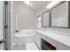 Bright bathroom with a soaking tub, a tiled shower, and double vanities with quartz countertops at 652 E Hobcaw Dr, Mount Pleasant, SC 29464