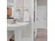 Bathroom featuring a pedestal sink with white fixtures and tile flooring at 652 E Hobcaw Dr, Mount Pleasant, SC 29464