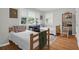 Cozy bedroom with two twin beds, wood floors, and a large window at 652 E Hobcaw Dr, Mount Pleasant, SC 29464