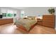 Comfortable bedroom featuring wood floors and a queen bed with coordinating dressers at 652 E Hobcaw Dr, Mount Pleasant, SC 29464