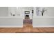 Hallway view into living area with a fireplace and hearth at 652 E Hobcaw Dr, Mount Pleasant, SC 29464