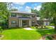 Beautiful brick home with a manicured lawn, mature trees, and a two car garage at 652 E Hobcaw Dr, Mount Pleasant, SC 29464