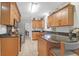 Spacious kitchen features tile flooring, stainless steel appliances, dark countertops and wood cabinetry at 652 E Hobcaw Dr, Mount Pleasant, SC 29464