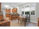 Bright kitchen with natural light, wood cabinetry, and a breakfast nook with large windows at 652 E Hobcaw Dr, Mount Pleasant, SC 29464