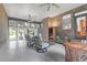 Spacious sunroom with seating, brick walls, ceiling fans, and large windows for ample natural light at 652 E Hobcaw Dr, Mount Pleasant, SC 29464