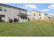 Large grassy backyard with a covered patio and a fenced in border at 7806 Park Gate Dr, North Charleston, SC 29418
