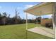 A covered patio offers a ceiling fan, and a wide open view of the backyard at 7806 Park Gate Dr, North Charleston, SC 29418