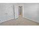 Bedroom featuring carpet, closet, and an adjoining room that creates a sense of space at 7806 Park Gate Dr, North Charleston, SC 29418