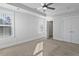 A light filled bedroom offers carpet, a ceiling fan, walk in closet, and natural light at 7806 Park Gate Dr, North Charleston, SC 29418