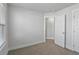 Bedroom with carpet and large window providing ample natural light in this neutrally colored space at 7806 Park Gate Dr, North Charleston, SC 29418