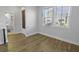 Comfortable bedroom featuring wood-look floors, natural light and attached bathroom access at 7806 Park Gate Dr, North Charleston, SC 29418