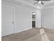 This bright carpeted bedroom has an attached bathroom and closet for ample storage at 7806 Park Gate Dr, North Charleston, SC 29418