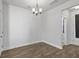 Inviting dining area with wood-look floors and simple light fixture with an easy flow at 7806 Park Gate Dr, North Charleston, SC 29418
