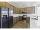 Modern kitchen with stainless steel appliances, quartz countertops, and stylish cabinets at 7806 Park Gate Dr, North Charleston, SC 29418