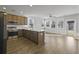 Bright, open-concept kitchen with stainless steel appliances and an island with bar seating at 7806 Park Gate Dr, North Charleston, SC 29418